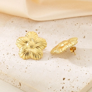 Vintage golden flower stud earrings with detailed metallic petal texture and shell finish