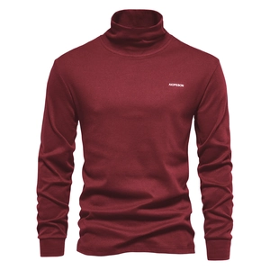 Close-up of deep wine red turtleneck shirt featuring premium knit texture and white logo