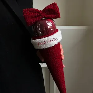 Handheld Christmas red fleece cone gift wrap with bow and plush trim for apples