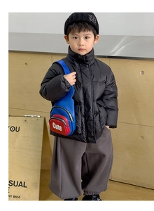 Detail of a kids sporty crossbody chest bag with Cute lettering on a stylish winter outfit