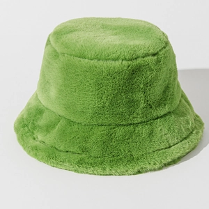Close-up of vibrant green plush bucket hat showing soft faux fur texture and warm fabric