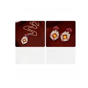 Detail view of vintage geometric shield pendant and earrings with size and weight parameters