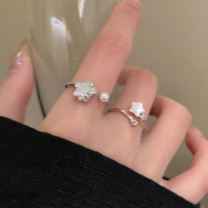 Elegant silver star and pearl open ring set with zircon details on female finger