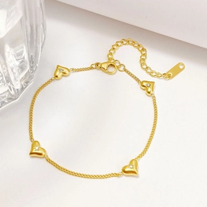 Elegant gold titanium heart bracelet with star-set crystals and adjustable lobster clasp