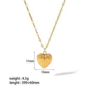 Detailed view of gold heart pendant with 3D relief texture and size measurements