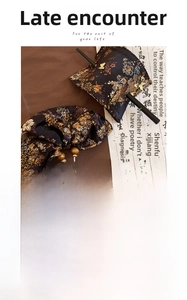 Detail of embroidered fabric flower hair pin with sandalwood base and 15cm length
