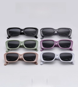 Group shot of rectangular vintage sunglasses in six diverse colors on a gray backdrop