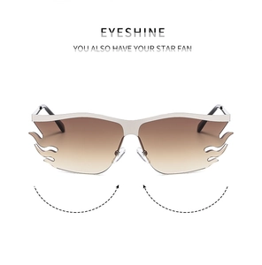 Detail view of silver metal sunglasses with brown gradient flame shaped lenses