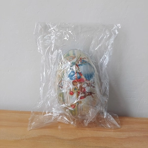 Easter egg storage box in tinplate with vintage bunny print inside plastic packaging