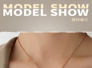 Close-up of minimalist 18K gold plated titanium O-chain necklace on a model