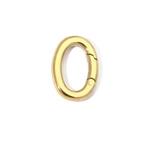 Detailed view of a polished gold oval spring clasp for DIY jewelry or bag hardware