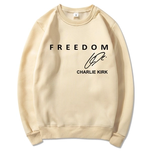 Detail view of beige sweatshirt neckline with M size tag and Freedom text print