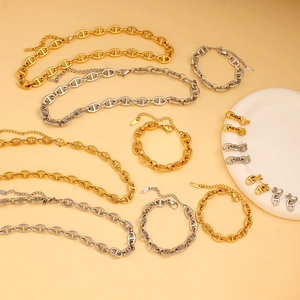Detail of stainless steel pig nose chain necklaces and bracelets with 18K gold plating