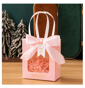 Pink gift bag with transparent window, large ribbon bow and thank you tag detail