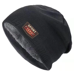 Classic black knitted beanie for men and women with warm fleece lining and sport leather patch