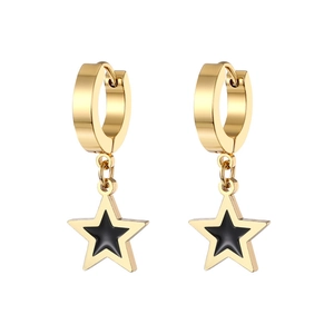 Detail of gold-plated hoop earrings featuring black enamel star charms on white background