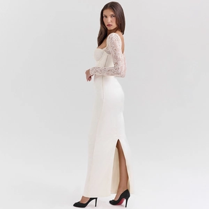 Elegant white satin gown detail with lace sleeves and high side slit on model
