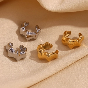 Bamboo style 18K gold and silver plated stainless steel ear cuffs on silk fabric