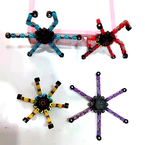 Deformable chain mechanical fidget spinners in blue, red, yellow and purple colors