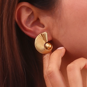 Polished 18K gold plated fan-shaped heart earrings on model with vintage pleated texture