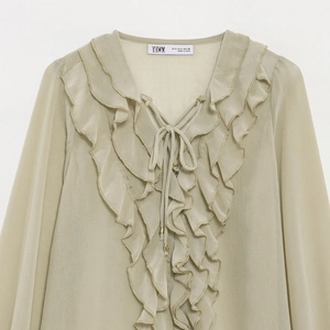 Chic light green ruffle tie-neck translucent blouse with layered crepe texture detail