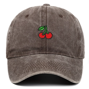 Detailed view of red cherry embroidery on vintage washed cotton baseball cap