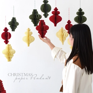 Handheld Christmas paper honeycomb ball pendant in red, cream, and dark green decor