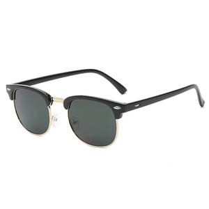 Classic semi-rimless polarized sunglasses in black and gold with dark green lenses