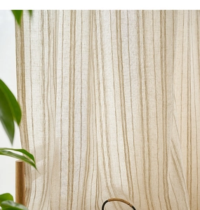 Detailed view of beige cotton linen curtain with vertical stripes and natural light