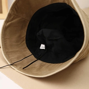 Adjustable khaki cotton linen sun hat with interior drawstring and breathable black lining