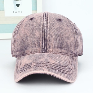 Classic washed pink cotton baseball cap with vintage distressed texture and curved brim