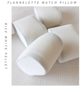 Detail view of cream velvet watch pillow with soft texture for gift box display