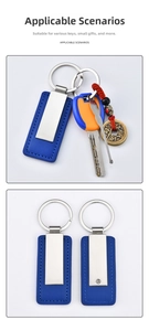 Detail view of a navy blue leather keychain with rectangular silver stainless steel plate