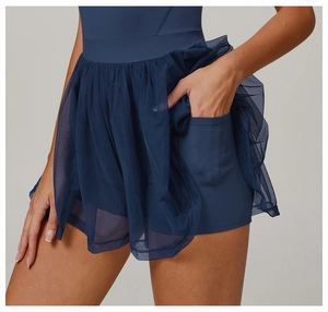 Detail showing inner shorts with functional pocket on breathable mesh tennis dress