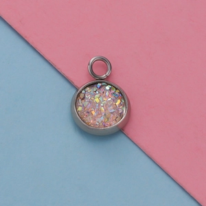 Detail of 12mm stainless steel pendant tray with pink glitter stones on split background