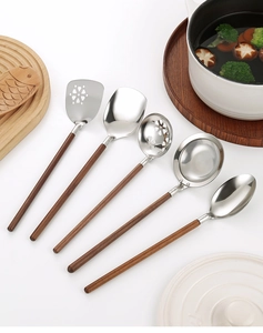 Flat lay of 5-piece 304 stainless steel kitchen utensils with walnut wood handles on counter