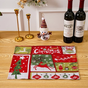 Detailed view of rectangular woven Christmas placemat with elk and tree patterns