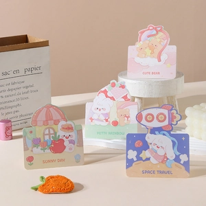 Close-up of cute cartoon animal cards including sunny day and space travel themes