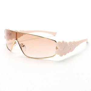 Y2K shield sunglasses with light brown lenses and pink heart metal frame decoration