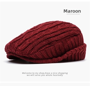 Detail of dark red knit beret featuring thick cable weave and warm fleece lining texture