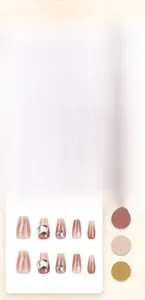 Close-up of pink gradient press-on nails with silver butterfly and rhinestone details