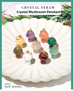 Macro shot of 9 mini mushroom pendants made of natural crystal and quartz in a shell dish