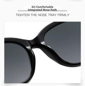 Detail of ergonomic integrated nose pads on glossy black oval oversized sunglasses