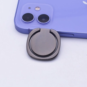 Close-up of matte dark gray metal ring holder on purple phone with 360-degree rotation