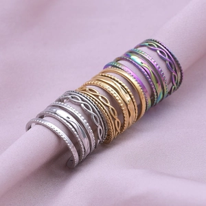 12-piece minimalist stainless steel ring set in silver, gold and rainbow finishes