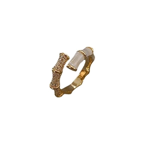 Bamboo style gold open ring with micro-set zircon and white cat eye stone accents