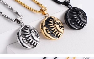 Detailed view of Yin Yang sun and moon relief pendants in gold, silver, and black finish