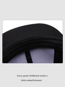 Close-up of black kid baseball cap showing high-quality twill fabric and sweatband detail