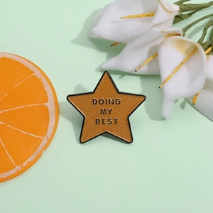 Sparkling star enamel pin with DOING MY BEST text on a mint green background