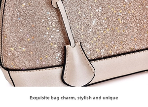 Detail of glitter handbag with star sequins, golden PU trim and decorative pendant charm